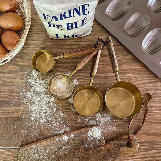 Generic Gold Stainless Steel Measuring Cups Set, 4 Pieces with Wooden Handles, 250ml-60ml .